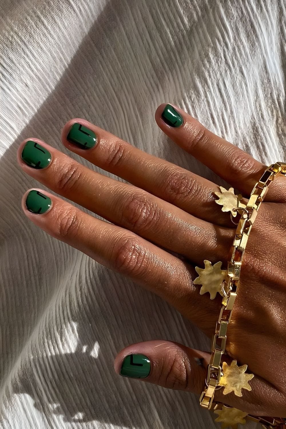 Dark Green Nails with Abstract Accents